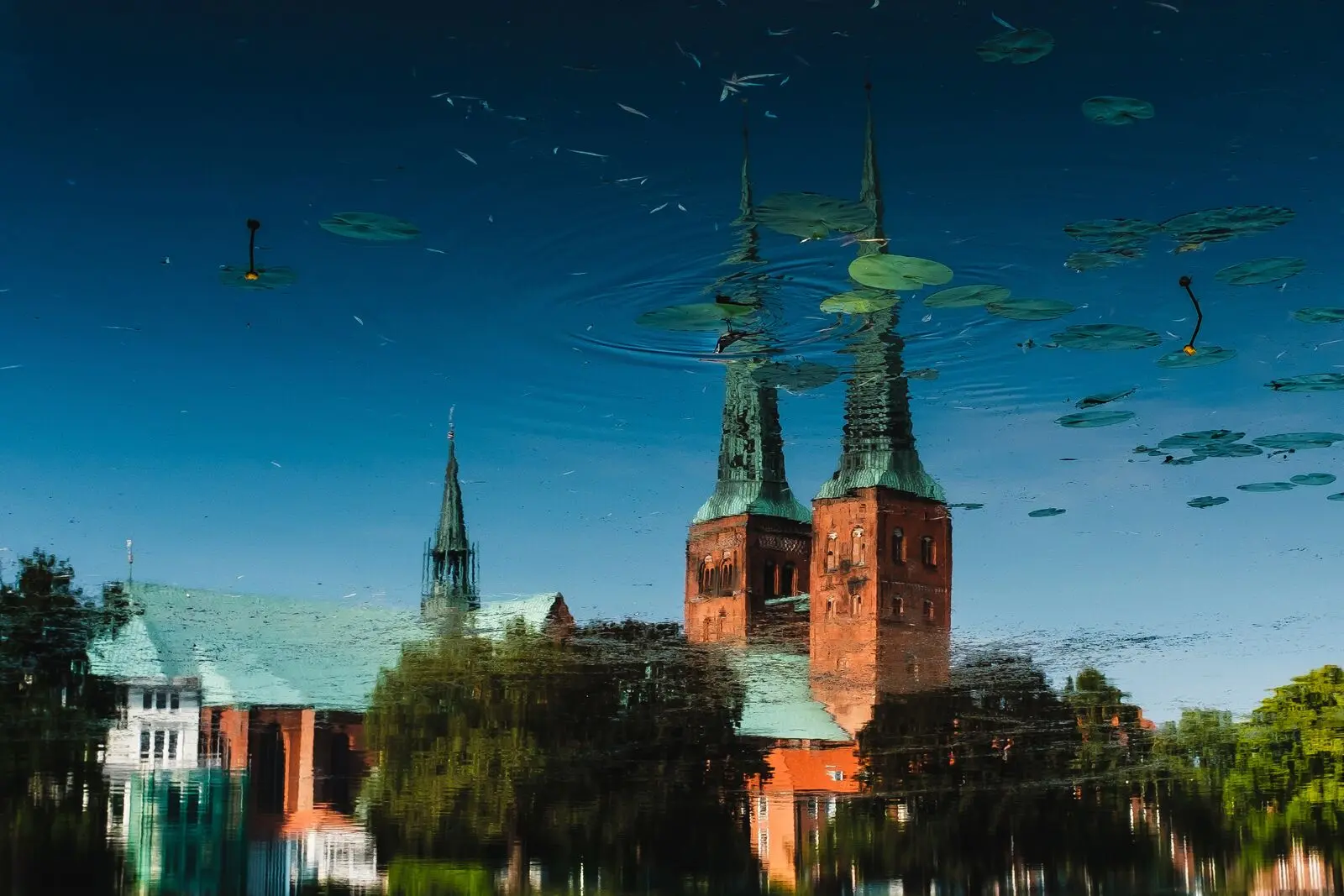 Lübeck cathedral upside down in a rippled water reflection